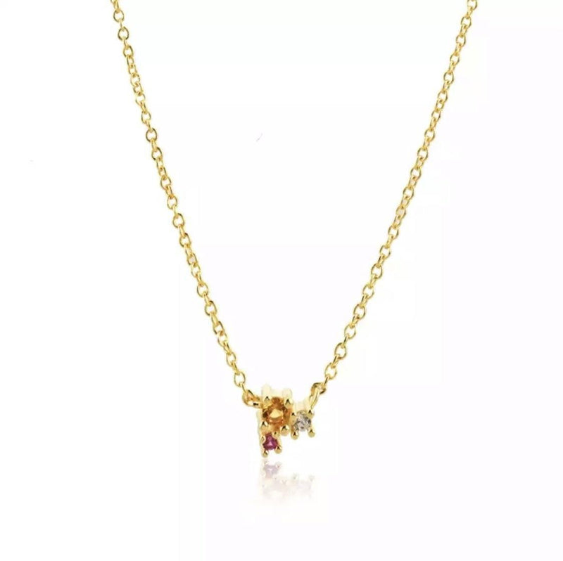 gold necklace with trio of gems